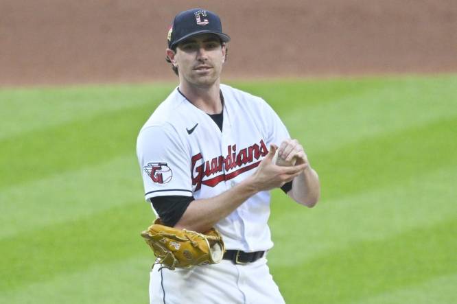 Jul 4, 2023; Cleveland, Ohio, USA; Cleveland Guardians starting pitcher Shane Bieber (57) reacts after giving up a home run in the fifth inning against the Atlanta Braves at Progressive Field. Mandatory Credit: David Richard-USA TODAY Sports