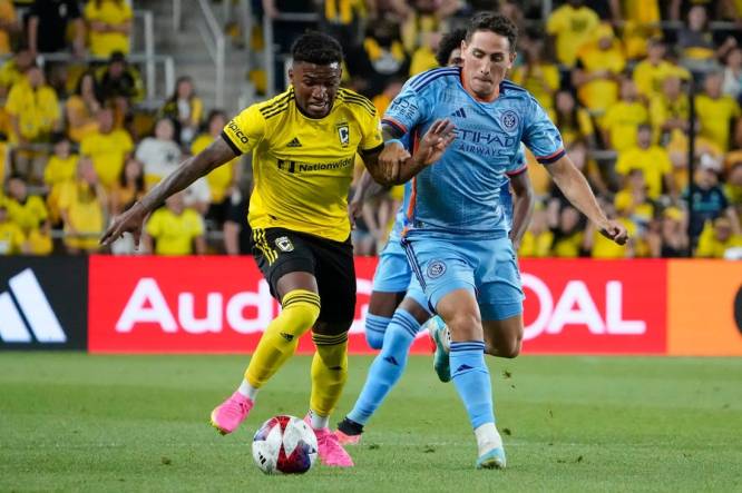 Jul 8, 2023; Columbus, Ohio, USA;  Columbus Crew midfielder Luis Diaz (11) runs past New York City FC defender Braian Cufre (3) during the second half of the MLS soccer match at Lower.com Field. Diaz was brought down by Cufre on the play but no foul was called, resulting in Columbus Crew head coach Wilfried Nancy being given a red card for his protest. The Crew tied 1-1.
