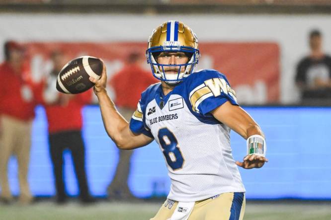 Jul 1, 2023; Montreal, Quebec, CAN; Winnipeg Blue Bombers quarterback Zach Collaros (8) passes the ball against the Montreal Alouettes during the first quarter at Percival Molson Memorial Stadium. Mandatory Credit: David Kirouac-USA TODAY Sports