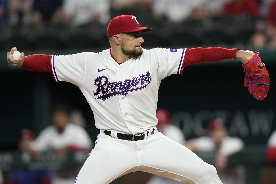 Jul 18, 2023; Arlington, Texas, USA; Texas Rangers starting pitcher Nathan Eovaldi (17) delivers a pitch to the Tampa Bay Rays during the first inning at Globe Life Field. Mandatory Credit: Jim Cowsert-USA TODAY Sports