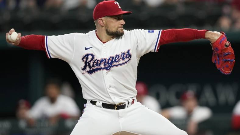 Jul 18, 2023; Arlington, Texas, USA; Texas Rangers starting pitcher Nathan Eovaldi (17) delivers a pitch to the Tampa Bay Rays during the first inning at Globe Life Field. Mandatory Credit: Jim Cowsert-USA TODAY Sports