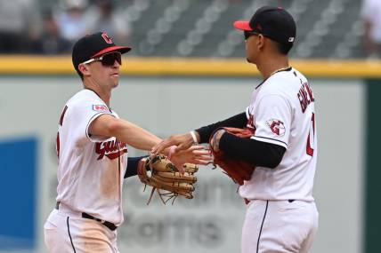 Jul 26, 2023; Cleveland, Ohio, USA; Cleveland Guardians right fielder Will Brennan (17) and second baseman Andres Gimenez (0) celebrate after the Guardians beat the Kansas City Royals at Progressive Field. Mandatory Credit: Ken Blaze-USA TODAY Sports