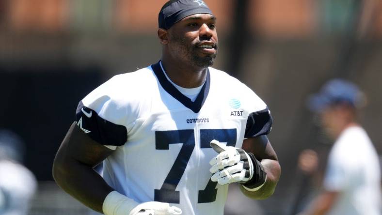 Jul 27, 2023; Oxnard, CA, USA; Dallas Cowboys tackle Tyron Smith (77) during training camp at Marriott Residence Inn-River Ridge Playing Fields. Mandatory Credit: Kirby Lee-USA TODAY Sports