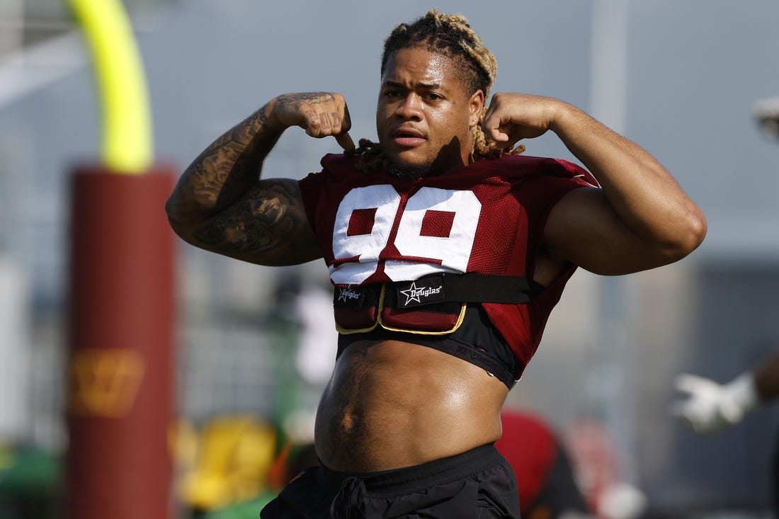 Jul 28, 2023; Ashburn, VA, USA; Washington Commanders defensive end Chase Young (99) gestures on day three of Commanders training camp at OrthoVirginia Training Center. Mandatory Credit: Geoff Burke-USA TODAY Sports