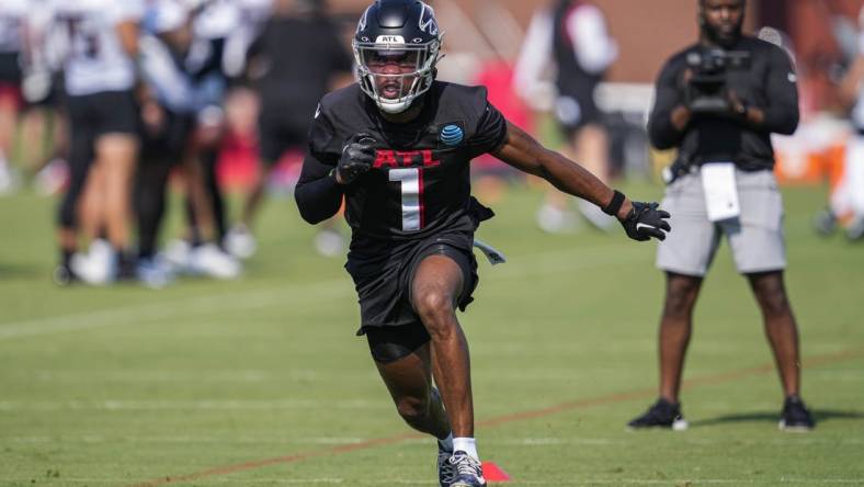 Jul 28, 2023; Flowery Branch, GA, USA; Atlanta Falcons cornerback Jeff Okudah (1)  runs during a drill during training camp at IBM Performance Field. Mandatory Credit: Dale Zanine-USA TODAY Sports