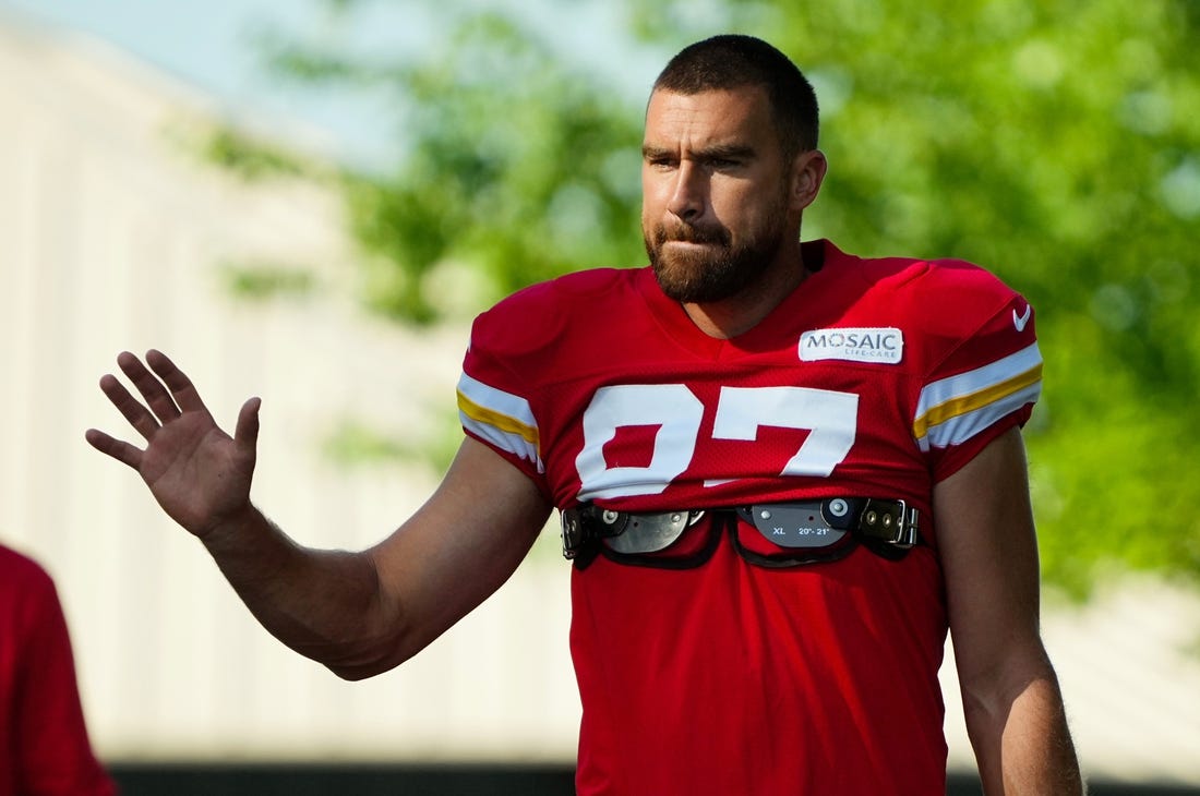 Jul 28, 2023; St. Joseph, MO, USA; Kansas City Chiefs tight end Travis Kelce (87) greets fans as he arrives prior to training camp at Missouri Western State University. Mandatory Credit: Jay Biggerstaff-USA TODAY Sports