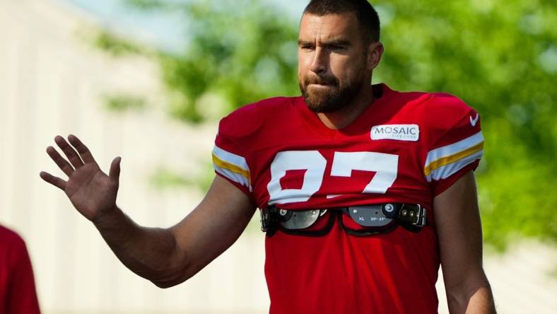 Jul 28, 2023; St. Joseph, MO, USA; Kansas City Chiefs tight end Travis Kelce (87) greets fans as he arrives prior to training camp at Missouri Western State University. Mandatory Credit: Jay Biggerstaff-USA TODAY Sports