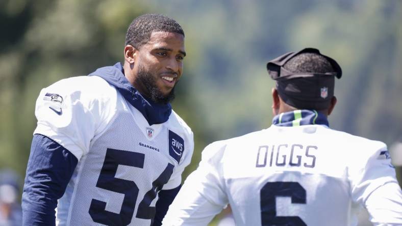 Jul 28, 2023; Renton, WA, USA; Seattle Seahawks linebacker Bobby Wagner (54) talks with safety Quandre Diggs (6) during training camp practice at the Virginia Mason Athletic Center. Mandatory Credit: Joe Nicholson-USA TODAY Sports