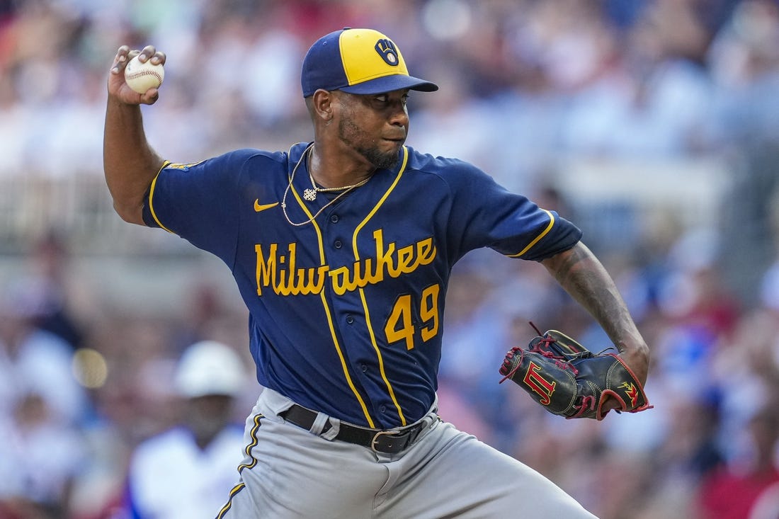 Jul 29, 2023; Cumberland, Georgia, USA; Milwaukee Brewers starting pitcher Julio Teheran (49) pitches against the Atlanta Braves during the first inning at Truist Park. Mandatory Credit: Dale Zanine-USA TODAY Sports
