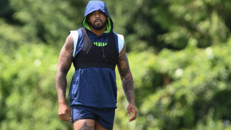 Jul 30, 2023; Renton, WA, USA; Seattle Seahawks safety Jamal Adams (33) warms up prior to training camp at Virginia Mason Athletic Center. Mandatory Credit: Steven Bisig-USA TODAY Sports