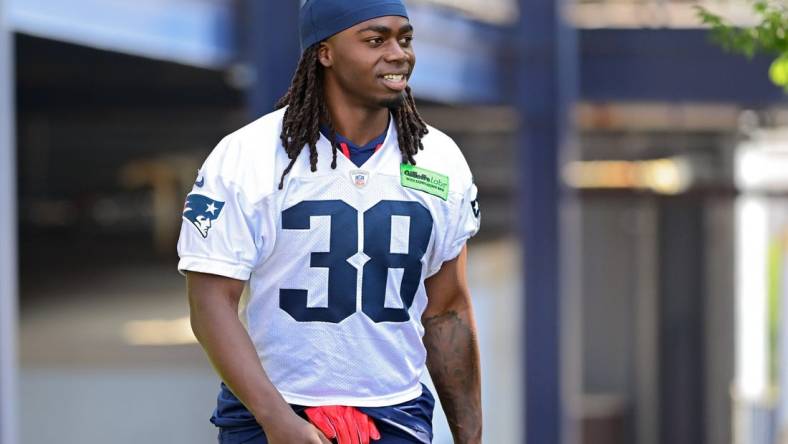 Jul 26, 2023; Foxborough, MA, USA; New England Patriots running back Rhamondre Stevenson (38) makes his way to the practice fields for  training camp at Gillette Stadium. Mandatory Credit: Eric Canha-USA TODAY Sports