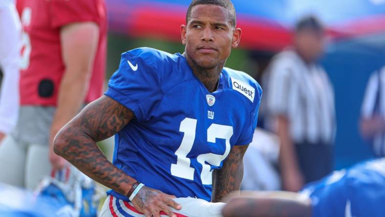 Aug 1, 2023; East Rutherford, NJ, USA; New York Giants tight end Darren Waller (12) stretches during training camp at the Quest Diagnostics Training Facility.  Mandatory Credit: Vincent Carchietta-USA TODAY Sports