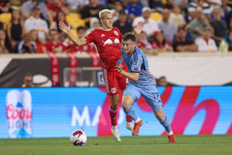 Aug 3, 2023; Harrison, NJ, USA; New York City FC midfielder Matias Pellegrini (17) plays the ball against New York Red Bulls defender Andres Reyes (4) during the second half at Red Bull Arena. Mandatory Credit: Vincent Carchietta-USA TODAY Sports
