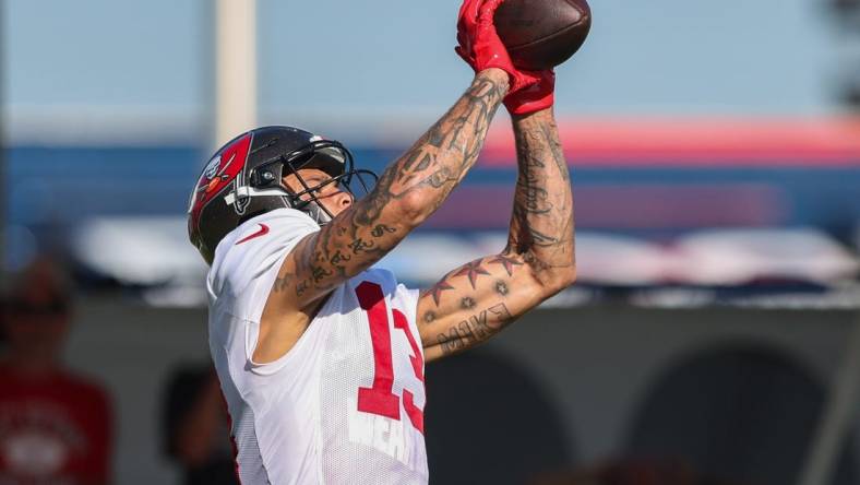 Aug 3, 2023; Tampa Bay, FL, USA;  Tampa Bay Buccaneers wide receiver Mike Evans (13) participates in training camp at AdventHealth Training Center. Mandatory Credit: Nathan Ray Seebeck-USA TODAY Sports