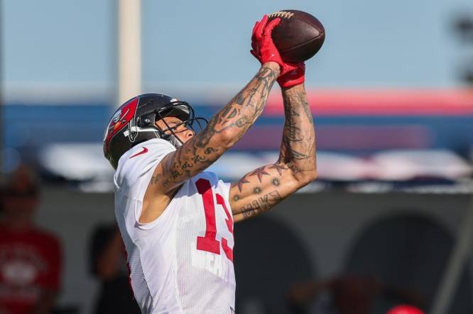 Aug 3, 2023; Tampa Bay, FL, USA;  Tampa Bay Buccaneers wide receiver Mike Evans (13) participates in training camp at AdventHealth Training Center. Mandatory Credit: Nathan Ray Seebeck-USA TODAY Sports