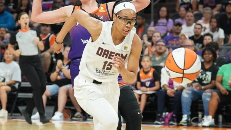 Aug 3, 2023; Phoenix, Arizona, USA; Atlanta Dream guard Allisha Gray (15) chases the ball against Phoenix Mercury center Megan Gustafson (10) during the game at at Footprint Center. Mandatory Credit: Joe Camporeale-USA TODAY Sports