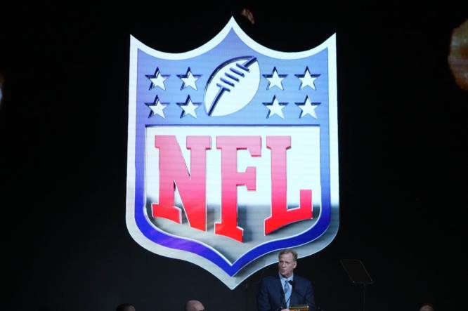 Aug 4, 2023; Canton, OH, USA; NFL commissioner Roger Goodell speaks with the NFL shield as a backdrop during the Pro Football Hall of Fame Gold Jacket dinner at Canton Civic Center. Mandatory Credit: Kirby Lee-USA TODAY Sports