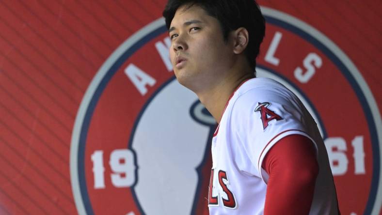 Aug 5, 2023; Anaheim, California, USA; Los Angeles Angels designated hitter Shohei Ohtani (17) looks on from the dugout during the game against the Seattle Mariners at Angel Stadium. Mandatory Credit: Jayne Kamin-Oncea-USA TODAY Sports