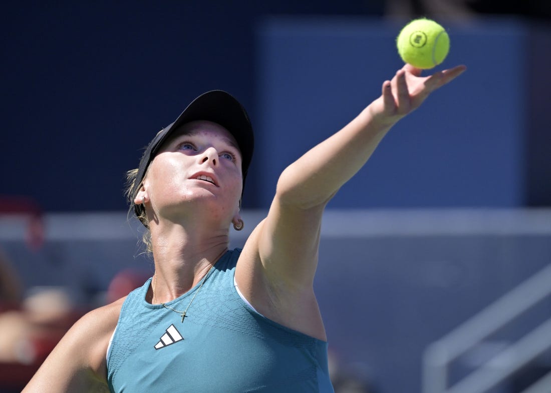 Aug 6, 2023; Montreal, Quebec, Canada; Ashlyn Krueger (USA) serves against Camila Giorgi (ITA) (not pictured) in second round qualifying play at IGA Stadium. Mandatory Credit: Eric Bolte-USA TODAY Sports