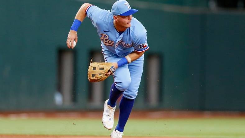 Aug 6, 2023; Arlington, Texas, USA; Texas Rangers third baseman Josh Jung (6) fields a ground ball during the first inning against the Miami Marlins at Globe Life Field. Mandatory Credit: Andrew Dieb-USA TODAY Sports