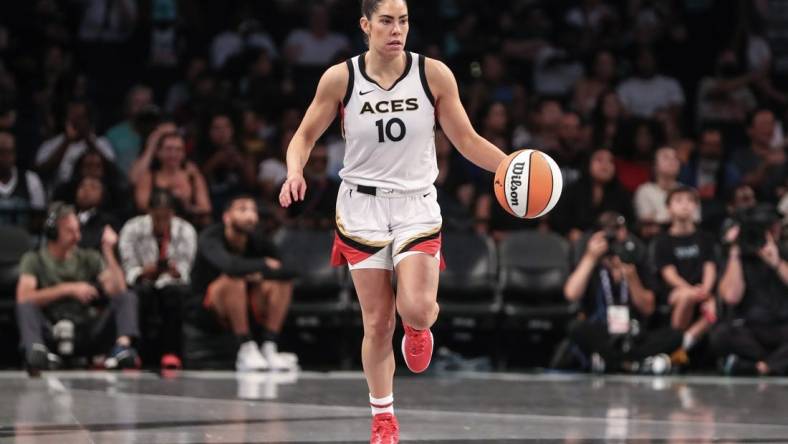 Aug 6, 2023; Brooklyn, New York, USA; Las Vegas Aces guard Kelsey Plum (10) brings the ball up court in the third quarter against the New York Liberty at Barclays Center. Mandatory Credit: Wendell Cruz-USA TODAY Sports