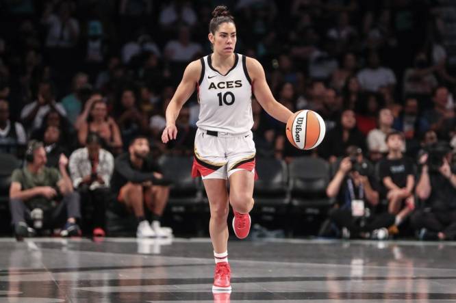 Aug 6, 2023; Brooklyn, New York, USA; Las Vegas Aces guard Kelsey Plum (10) brings the ball up court in the third quarter against the New York Liberty at Barclays Center. Mandatory Credit: Wendell Cruz-USA TODAY Sports