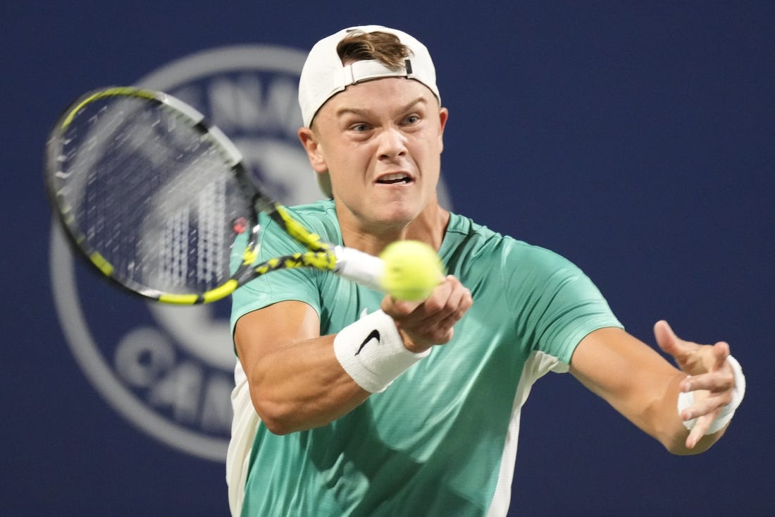 Aug 9, 2023; Toronto, Ontario, Canada; Holger Rune (DEN) hits a ball to Marcos Giron (not pictured) at Sobeys Stadium. Mandatory Credit: John E. Sokolowski-USA TODAY Sports