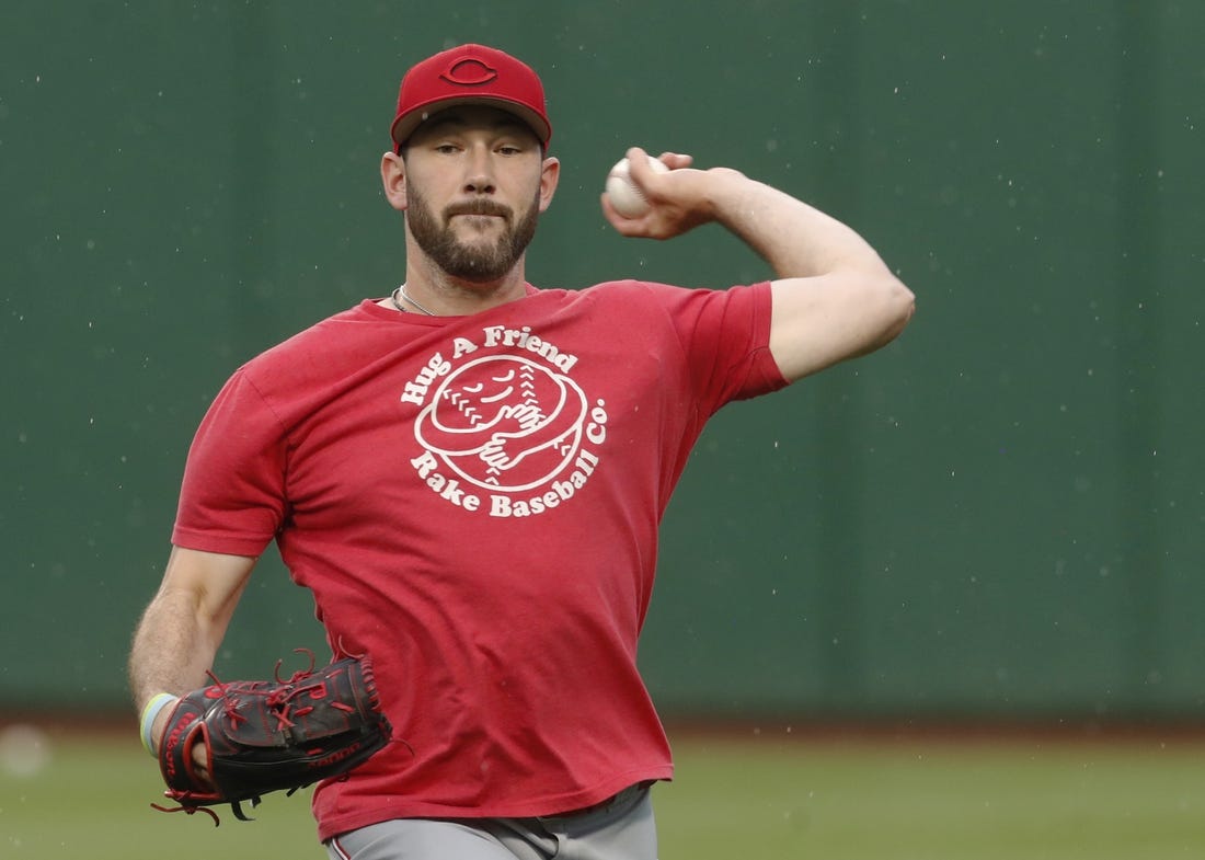 Aug 12, 2023; Pittsburgh, Pennsylvania, USA; Cincinnati Reds relief pitcher Alex Young (48) throws in the outfield before the game against the Pittsburgh Pirates at PNC Park. Mandatory Credit: Charles LeClaire-USA TODAY Sports