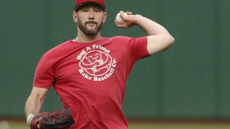 Aug 12, 2023; Pittsburgh, Pennsylvania, USA; Cincinnati Reds relief pitcher Alex Young (48) throws in the outfield before the game against the Pittsburgh Pirates at PNC Park. Mandatory Credit: Charles LeClaire-USA TODAY Sports