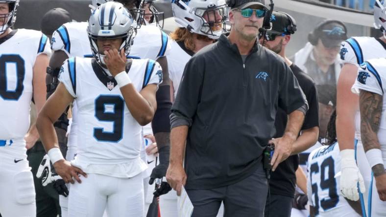 Aug 12, 2023; Charlotte, North Carolina, USA; Carolina Panthers head coach Frank Reich stands on the sideline with quarterback Bryce Young (9) during the first quarter against the New York Jets at Bank of America Stadium. Mandatory Credit: Jim Dedmon-USA TODAY Sports