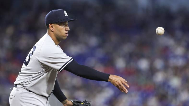 Aug 13, 2023; Miami, Florida, USA; New York Yankees relief pitcher Keynan Middleton (93) tosses the baseball to first base and retires Miami Marlins right fielder Jesus Sanchez (not pictured) during the eighth inning at loanDepot Park. Mandatory Credit: Sam Navarro-USA TODAY Sports