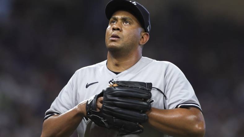 Aug 13, 2023; Miami, Florida, USA; New York Yankees relief pitcher Wandy Peralta (58) looks on as he leaves the game against the Miami Marlins during the eighth inning at loanDepot Park. Mandatory Credit: Sam Navarro-USA TODAY Sports