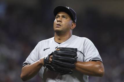 Aug 13, 2023; Miami, Florida, USA; New York Yankees relief pitcher Wandy Peralta (58) looks on as he leaves the game against the Miami Marlins during the eighth inning at loanDepot Park. Mandatory Credit: Sam Navarro-USA TODAY Sports