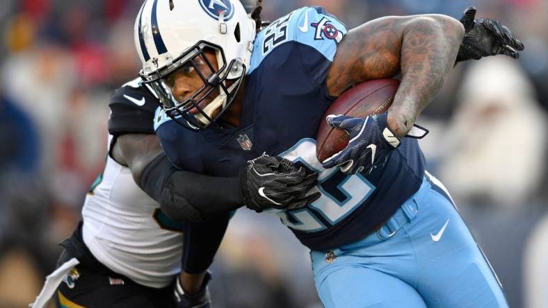 Running back Derrick Henry (22), in action against Jacksonville Jaguars in Nashville on Dec. 31, was the Tennessee Titans' leading rusher for 2017 with 744 yards on 176 carries with 5 rushing touchdowns.