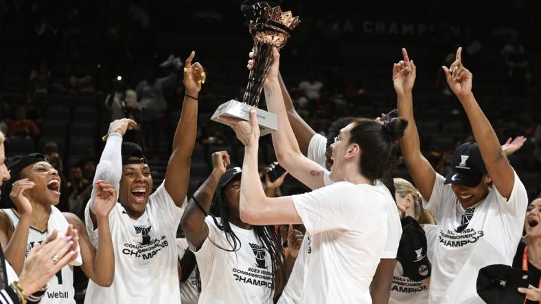 Aug 15, 2023; Las Vegas, Nevada, USA; New York Liberty forward Breanna Stewart holds the Commissioner's Cup trophy while celebrating with teammates after defeating the Las Vegas Aces to win the Commissioner   s Cup Championship at Michelob Ultra Arena. Mandatory Credit: Candice Ward-USA TODAY Sports