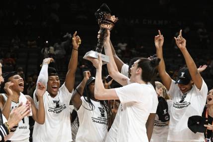 Aug 15, 2023; Las Vegas, Nevada, USA; New York Liberty forward Breanna Stewart holds the Commissioner's Cup trophy while celebrating with teammates after defeating the Las Vegas Aces to win the Commissioner   s Cup Championship at Michelob Ultra Arena. Mandatory Credit: Candice Ward-USA TODAY Sports