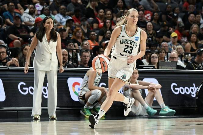Aug 15, 2023; Las Vegas, Nevada, USA; New York Liberty guard Marine Johannes (23) dribbles up the court against the Las Vegas Aces at Michelob Ultra Arena. Mandatory Credit: Candice Ward-USA TODAY Sports