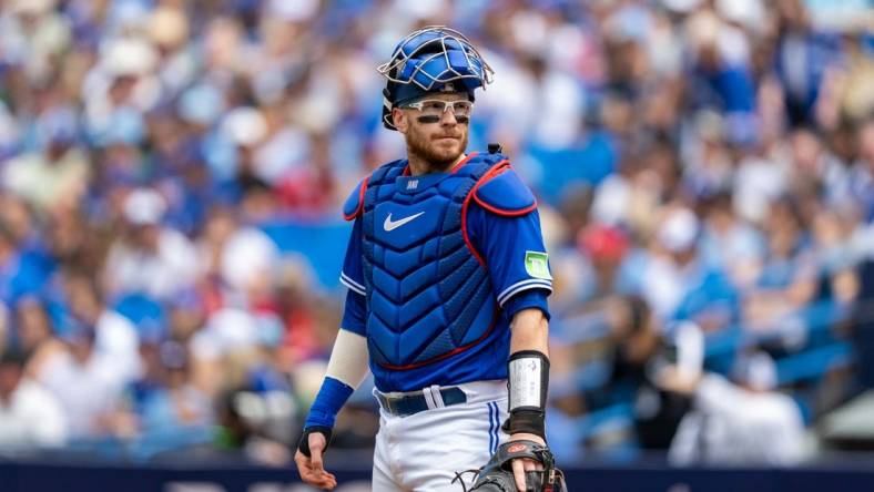 Aug 13, 2023; Toronto, Ontario, CAN; Toronto Blue Jays catcher Danny Jansen (9) looks on against the Chicago Cubs at Rogers Centre. Mandatory Credit: Kevin Sousa-USA TODAY Sports