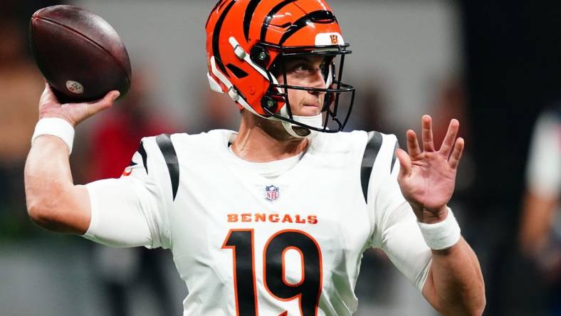 Aug 18, 2023; Atlanta, Georgia, USA; Cincinnati Bengals quarterback Trevor Siemian (19) rolls out to pass against the Atlanta Falcons during the first quarter at Mercedes-Benz Stadium. Mandatory Credit: John David Mercer-USA TODAY Sports