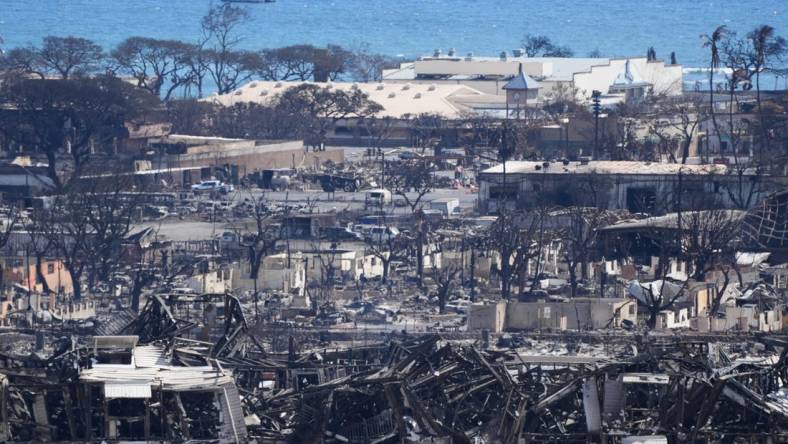 Aug. 12, 2023 : Burned houses and buildings are seen in Lahaina. Thousands were displaced after a wildfire fueled by winds from Hurricane Dora and dry vegetation destroyed much of the town. The death toll from the fire makes it the deadliest wildfire of the past U.S.