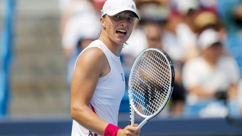 Aug 19, 2023; Mason, OH, USA; Iga Swiatek (POL) reacts after a point against Coco Gauff (USA) during the Western and Southern Open tennis tournament at Lindner Family Tennis Center. Mandatory Credit: Katie Stratman-USA TODAY Sports