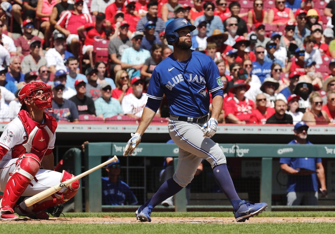 Aug 20, 2023; Cincinnati, Ohio, USA; Toronto Blue Jays designated hitter Brandon Belt (13) hits a two-run home run against the Cincinnati Reds during the second inning at Great American Ball Park. Mandatory Credit: David Kohl-USA TODAY Sports