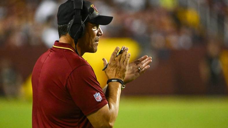 Aug 21, 2023; Landover, Maryland, USA; Washington Commanders head coach Ron Rivera on the field against the Baltimore Ravens during the first half at FedExField. Mandatory Credit: Brad Mills-USA TODAY Sports