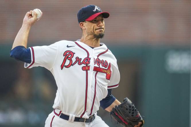 Aug 23, 2023; Cumberland, Georgia, USA; Atlanta Braves starting pitcher Charlie Morton (50) pitches against the New York Mets during the first inning at Truist Park. Mandatory Credit: Dale Zanine-USA TODAY Sports