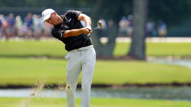 Jordan Spieth plays his shot on the on the eighth hole during the second round of the TOUR Championship golf tournament at East Lake Golf Club. Mandatory Credit: John David Mercer-USA TODAY Sports