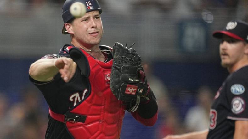 Aug 25, 2023; Miami, Florida, USA; Washington Nationals catcher Riley Adams (15) throws out Miami Marlins right fielder Jesus Sanchez (7) in the ninth inning at loanDepot Park. Mandatory Credit: Jim Rassol-USA TODAY Sports