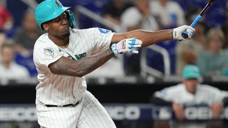 Aug 25, 2023; Miami, Florida, USA; Miami Marlins designated hitter Jorge Soler (12) strikes out in the fourth inning against the Washington Nationals at loanDepot Park. Mandatory Credit: Jim Rassol-USA TODAY Sports