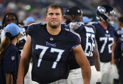 Aug 25, 2023; Nashville, Tennessee, USA; Tennessee Titans offensive tackle Peter Skoronski (77) walks the sideline during the second half against the New England Patriots at Nissan Stadium. Mandatory Credit: Christopher Hanewinckel-USA TODAY Sports