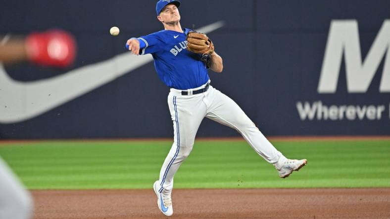 Aug 26, 2023; Toronto, Ontario, CAN;  Toronto Blue Jays third baseman Matt Chapman (26) throws to retire Cleveland Guardians left fielder Oscar Gonzalez (not shown) in the fourth inning at Rogers Centre. Mandatory Credit: Dan Hamilton-USA TODAY Sports