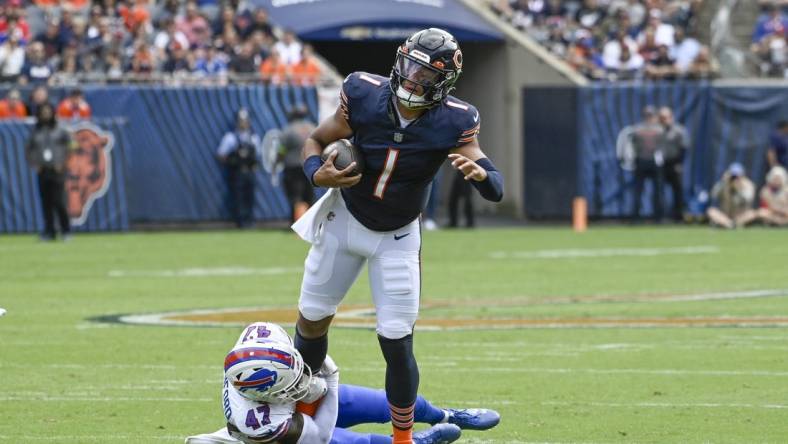 Aug 26, 2023; Chicago, Illinois, USA;  Chicago Bears quarterback Justin Fields (1) is stopped by Buffalo Bills cornerback Christian Benford (47) during the first half  at Soldier Field. Mandatory Credit: Matt Marton-USA TODAY Sports